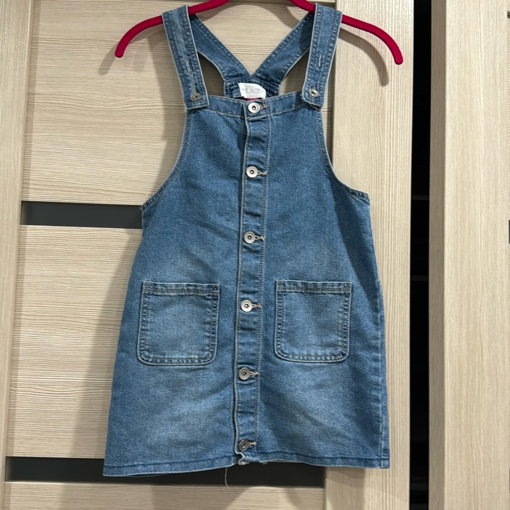 Children place denim overalls